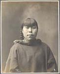 [Inuk woman with chin tattoos wearing a cloth parka]  1903