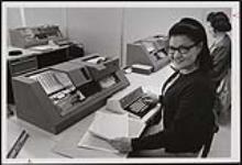 Laura Wasacase from the Kakawistaha Reserve in Saskatchewan, is an IBM operator with the Department of Indian Affairs and Northern Development. 1969