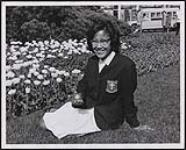 Corinne Canadian, 19, of Fort Providence, NWT, is pictured on the lawns of Parliament in Ottawa just after receiving a Centennial Medallion from the Governor General. 1967