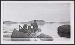 [Innu family paddling in a canoe]. [between 1925-1940]