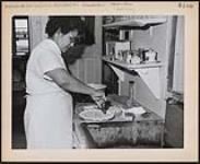 [Mrs. Aaron Soney is an Anishinaabe businesswoman, owning and operating a restaurant opposite the Ste. Clair ferry on Walpole Island Indian Reserve]. Original title: Mrs. Aaron Soney is an Indian businesswoman, owning and operating a restaurant opposite the Ste. Clair ferry on Walpole Island Indian Reserve. [ca. 1960]
