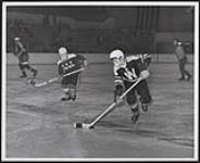 [Walpole Island and Parry Island juvenile hockey players playing in a tournament]. 1967