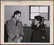 Here one of the cadets is seen in discussion with his Commanding Officer. 1958