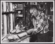 Ernest Couchie, former chief of the Nipissing Reserve band near North Bay, has been a taxidermist since 1912. [1912-1976]