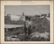 [Group of tents used by the Cree of Weenusk First Nation, on the shores of Hudson Bay]. Original title: Primitive living condition of Indians in the Winisk Territory on the shores of Hudson Bay, in Northern Ontario. [between 1900-1976]