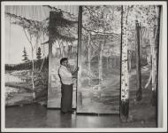 [Joseph Land with stage scenery he painted at the Motherhouse of the Oblate Sisters in Winnipeg]. [ca. 1960]
