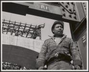 [Kanien¿keha:ka (Mohawk) construction worker standing on site]. [between 1900-1976]