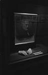 [Shop window with portrait of man and sculpted hands]. ca. 1954-56.