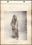 [Piikani Warrior, Acustie]. Original title: Piegan Indian Warrior, 'Acustie'. [between 1891 to before June 1896]