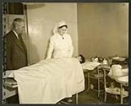 Dr. Burnett and Matron Mrs. Rendall of the Greenwood camp hospital. [1943/11-1943/12]