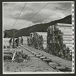 Piles of railway ties at the Lemon Creek sawmill. [1/2]. [1945/06/16-1945/06/28]