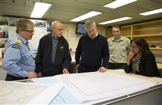 [Prime Minister Stephen Harper and Leona Aglukkaq are briefed on the Franklin expedition during their visit onboard the Sir Wilfrid Laurier coast guard ship with Captain Stuart Aldridge, Douglas Stenton, Director of Heritage for the Government of Nunavut, and Ryan Harris, Senior Marine Archaeologist in Gjoa Haven, Nunavut] 21 August 2013