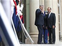 [Prime Minister Stephen Harper is greeted by French President François Hollande at the Palais de l'Élysée in Paris, France] 7 June 2012