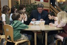 [Conservative Leader Stephen Harper reads "Pirate Pearl" to a group of young children while visiting the Copper House daycare in Bolton, Ontario] 6 January 2006