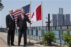 [Prime Minister Stephen Harper walks with Rick Snyder, Governor of Michigan, on the occasion of the conclusion of an agreement for the construction of the new Detroit River International Crossing in Windsor, Ontario] 15 June 2012