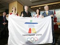 [Prime Minister Stephen Harper holds an Olympic flag with athletes and Premier Gordon Campbell during a funding announcement for the 2010 Vancouver Olympics] 30 August 2006