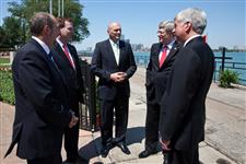 [Prime Minister Stephen Harper talks with Denis Lebel, John Baird, Jeff Watson and Rick Snyder, Governor of Michigan, on the occasion of the conclusion of an agreement for the construction of the new Detroit River International Crossing in Windsor, Ontario] 15 June 2012