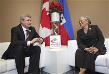[Prime Minister Stephen Harper hosts a bilateral meeting with Marie-Michele Rey, Haiti's Minister of Foreign Affairs, at the Francophonie Summit in Montreux, Switzerland] 23 October 2010