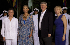 [President Juan Manuel Santos and his wife Maria Clemencia Rodriguez de Santos greet Prime Minister Stephen Harper and his wife Laureen Harper at the official leaders' dinner at Fort San Juan de Manzanillo in Cartagena, Colombia] 14 April 2012