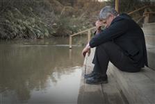 [Prime Minister Stephen Harper takes a moment at the edge of the River Jordan while in Bethany, Jordan] 24 January 2014