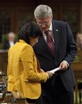 [Prime Minister Stephen Harper hands Olivia Chow the speech he delivered in honour of her late husband Jack Layton on the first day of the fall session on Parliament Hill] 19 September 2011