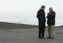 [Prime Minister Stephen Harper and Defence Minister Gordon O'Connor chat near the ice floes after arriving in Alert, Nunavut] 12 August 2006