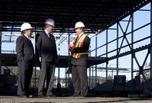 [Prime Minister Stephen Harper is joined by Gary Lunn and Stewart Young, Mayor of Langford, as he is given a tour of the City Centre Park Sportsplex, in Langford, British Columbia] 22 February 2011