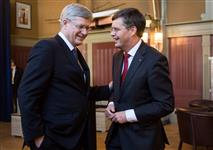 [Prime Minister Stephen Harper chats with with Jan Peter Balkenende, former Prime Minister of the Netherlands, at the Royal Maas Yacht Club in Rotterdam, Netherlands] 23 March 2014