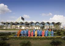 [Leaders attending the Asia-Pacific Economic Cooperation (APEC) summit pose for a family photo wearing traditional Vietnamese clothes, known as the 'ao dai,' outside the National Convention Centre in Hanoi, Vietnam] 19 November 2006