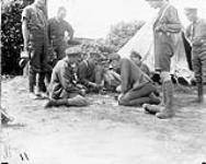 A game of cards (8th Infantry Battalion). May, 1916 May, 1916