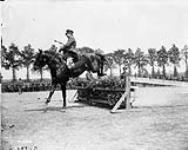 Jumping competition - Lieut. - Col. Rogers (Canadian Corps Horse Show - Reningelst, Belgium). July 19, 1916 July 19, 1916