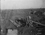 Examining a wrecked German field gun, Pozières, [France]. November, 1916 Nov., 1916.