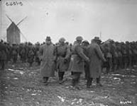 (Primer Minister Sir Robert Borden visits the western front) Hon. Bob Rogers with Prime Minister inspecting Canadian battalion. March, 1917 March, 1917.