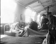 (Prime Minister Sir Robert Borden visits the Western Front) Sir Robert Borden chats to wounded man at Base Hospital. March, 1917 March, 1917.