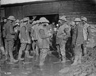 Canadians in trench, waders outside free Coffee Stall. March 1917 March, 1917.