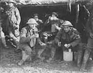 Canadian Red Cross Men enjoy a bite and a well earned rest. November, 1916 Nov., 1916.