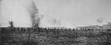 Canadians advancing through German wire entanglements - Vimy Ridge. April, 1917 April, 1917.