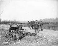 German ammunition limber smashed by our guns and a party of Germans bringing in their wounded from Arleux. May, 1917 May, 1917.