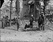 Dressing wounded Canadian at the Battle of Arleux. April, 1917 [ca. April 28-29, 1917].
