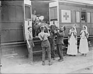 Wounded Canadians who took part in capture of Hill 70 leaving Casualty Clearing Station for Blighty. August 1917 Aug., 1917.