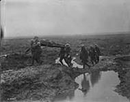 Wounded Canadians on way to aid-post during the Battle of Passchendaele Nov. 1917