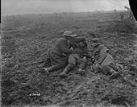 Walking wounded rest on way to an aid-post. Battle of Passchendaele. November, 1917 Nov., 1917.