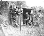 A Canadian gives his pals a little "Home Music" on his fiddle, outside their dug-out. December, 1917 Dec., 1917.