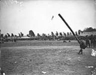 (General) Tossing the caber. Canadian Highland Sports Meet. July, 1918 July 1918.