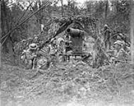 Resting around a German high velocity gun. Battle of Amiens. August, 1918 Aug., 1918.