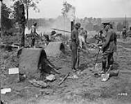 General Mewburn watching men from Nova Scotia making clay ovens. July, 1918 July 1918.