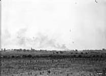 German incendiary shells bursting in village captured by Canadians. Advance East of Arras. September, 1918 September, 1918.