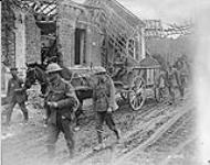 Bringing back a captured German transport wagon and prisoners. October, 1918. Advance East of Arras October, 1918.