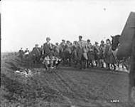Civilians from the outskirts of Mons pass 42nd Battalion on their way up. November, 1918 Nov., 1918