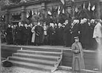 President Poncaire addressing the deputy Mayors of Valenciennes, General Horne and General Watson, from the steps of the Hotel de Ville on Nov. 10th, 1918 November 1918.